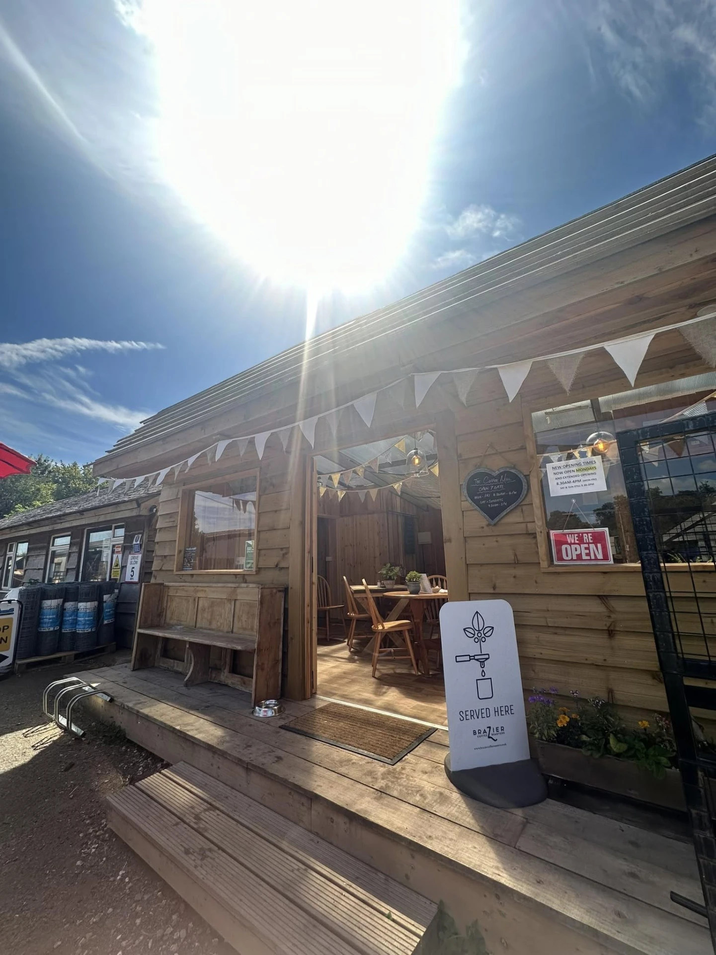 The sunny timber entrance to The Coffee Mill